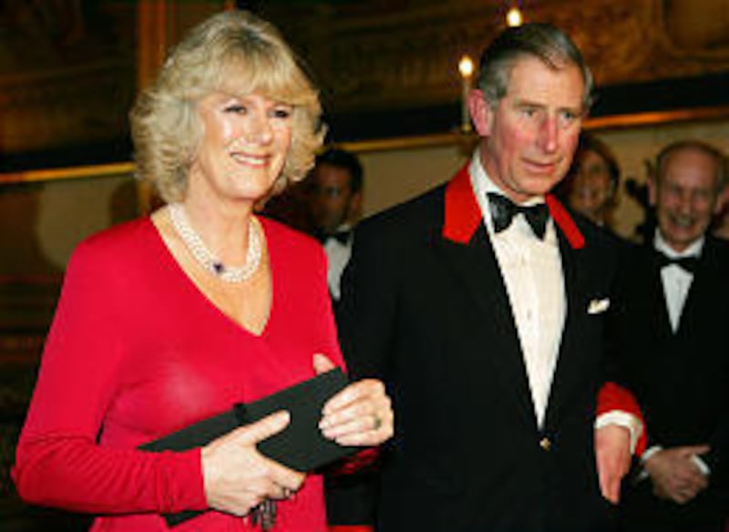 Prince Charles and fiancee Camilla Parker Bowles at Windsor Castle Thursday. Her ring is a royal heirloom.