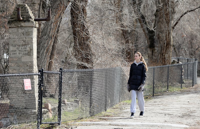 Makaylee Clark walks through Allen Park in Salt Lake City on Tuesday.