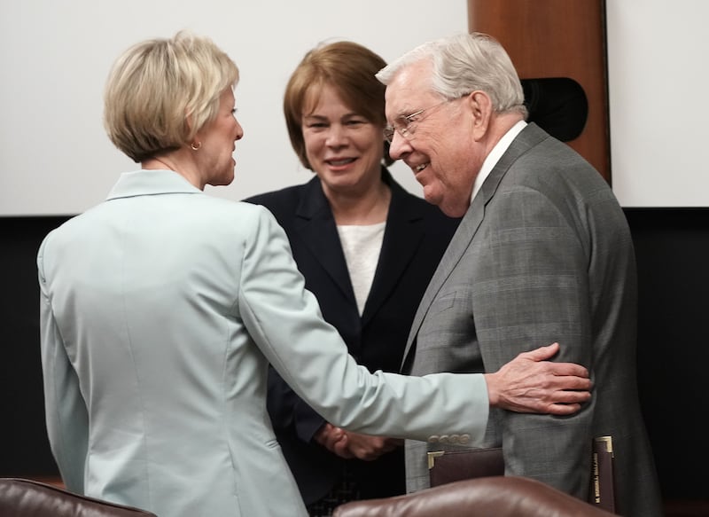 President Ballard speaks with President Jean B. Bingham and Sister Sharon Eubank before a meeting.