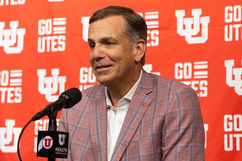 Utah athletic director Mark Harlan speaks at a press conference.