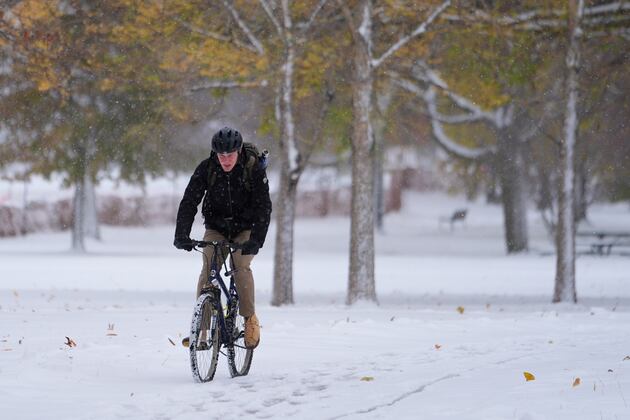 Early-season arctic blast blankets Midwest and East with snow and record cold