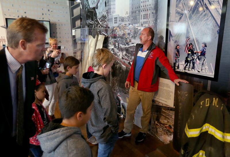 Billy Puckett leads a tour of the 9/11 Never Forget Mobile Exhibit at Centennial Park in West Valley City on Thursday, May 23, 2019.