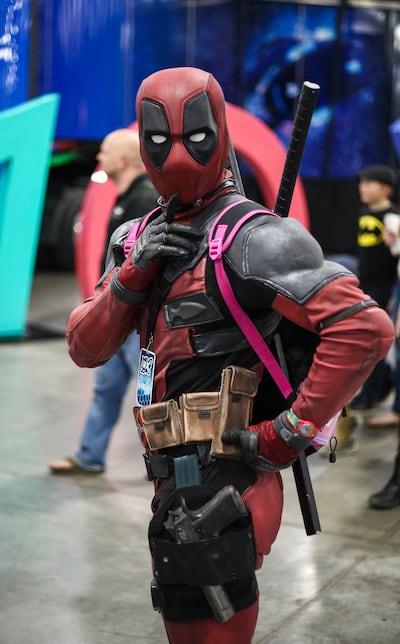 A cosplayer dressed as the character Deadpool poses for a photo during the FanX Spring Comic Convention at the Salt Palace Convention Center in Salt Lake City on Friday, April 19, 2019.