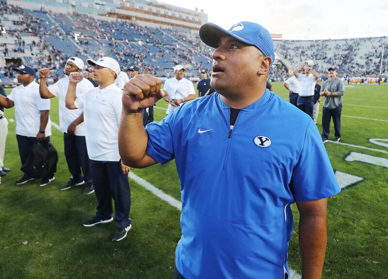 Brigham Young Cougars head coach Kalani Sitaki sings the fight song after beating the McNeese State Cowboys in Provo on Saturday, Sept. 22, 2018. BYU won 30-3.
