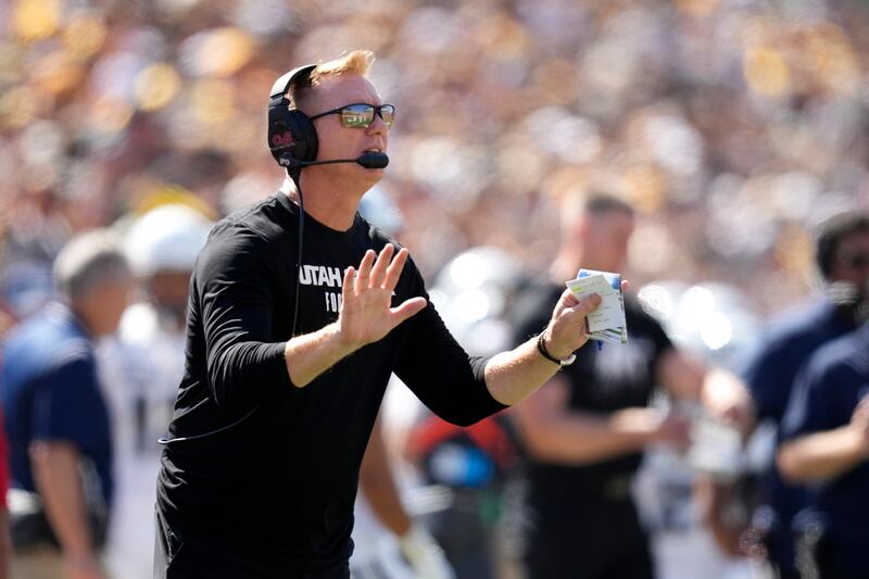 Utah State coach Blake Anderson watches from the sideline during a game against Iowa on Sept. 2, 2023.