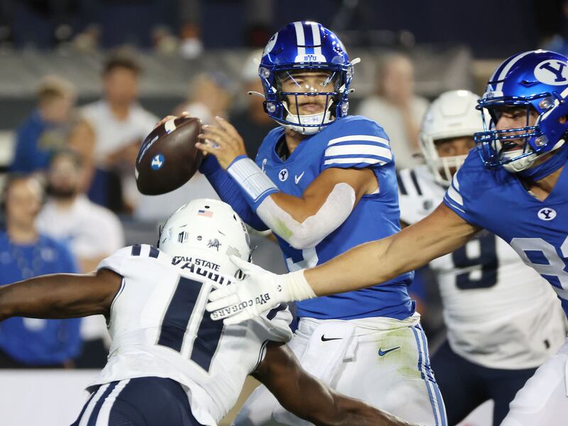 Brigham Young Cougars quarterback Jaren Hall (3) throws against USU in Provo on Thursday, Sept. 29, 2022.