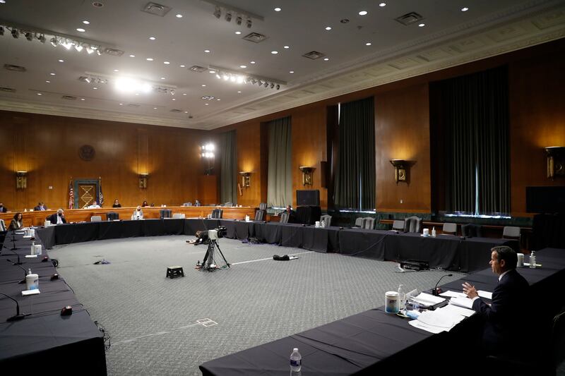 Rep. John Ratcliffe, R-Texas, right testifies before a Senate Intelligence Committee nomination hearing on Capitol Hill in Washington, Tuesday, May. 5, 2020. The panel is considering Ratcliffe’s nomination for director of national intelligence.