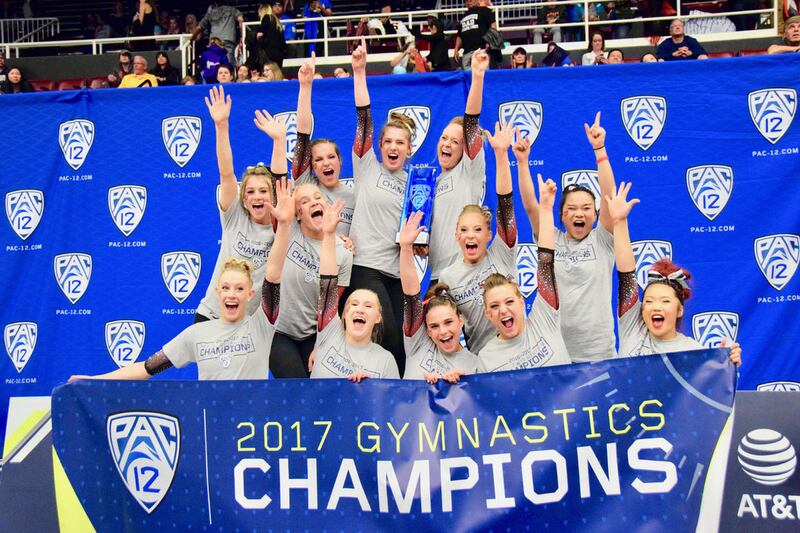 The University of Utah gymnastics team celebrates after winning the Pac-12 Conference championship.
