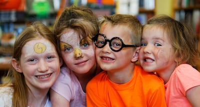 Elayna, Kaylee, Garrin and Ellora Rupper pose for a photo during The History of Magic launch at The King's English Bookshop in Salt Lake City on Friday, Oct. 20, 2017. Some in the Utah community attribute the rise in popularity of young adult fiction over
