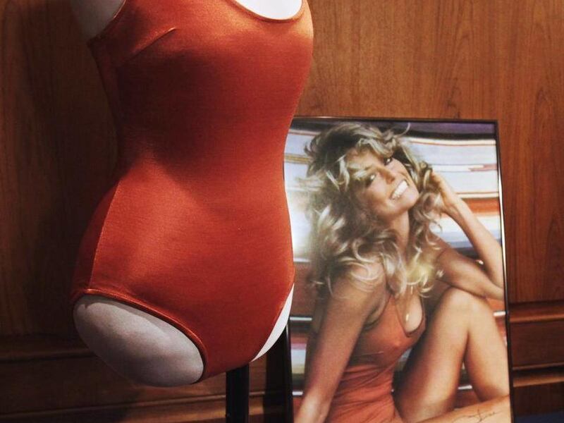 Objects from the private collection of Farrah Fawcett's estate, including the red swimsuit from her iconic 1976 poster, right, are seen at the Smithsonian's National Museum of American History, in Washington, Wednesday, Feb. 2, 2011, where they were donat