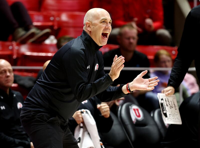 Utah head coach Craig Smith cheers as Utah and Westminster play in an exhibition game at the Huntsman Center.