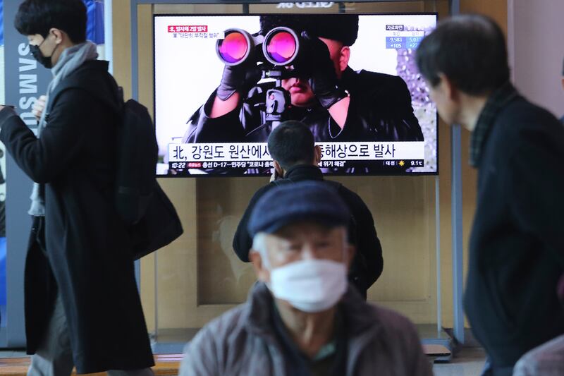 People pass by a TV screen showing a file image of North Korean leader Kim Jong Un during a news program at the Seoul Railway Station in Seoul, South Korea, Sunday, March 29, 2020. North Korea on Sunday fired two suspected ballistic missiles into the sea, South Korea said, calling it “very inappropriate” at a time when the world is battling the coronavirus pandemic. The Korean letters read: “ North Korea launched two suspected ballistic missiles into the sea.” (AP Photo/Ahn Young-joon)
