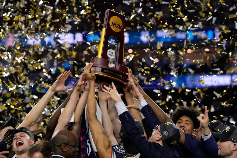 Connecticut celebrates with the trophy after a win against San Diego State during the men’s national championship in the NCAA Tournament on April 3, 2023.
