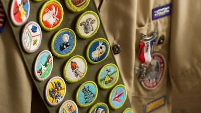 A photo of Boy Scout merit badges. Despite the new Boy Scouts of America changes, the LDS Church will continue to meet the needs of young women through Activity Days and Personal Progress programs, says church spokesman Eric Hawkins.