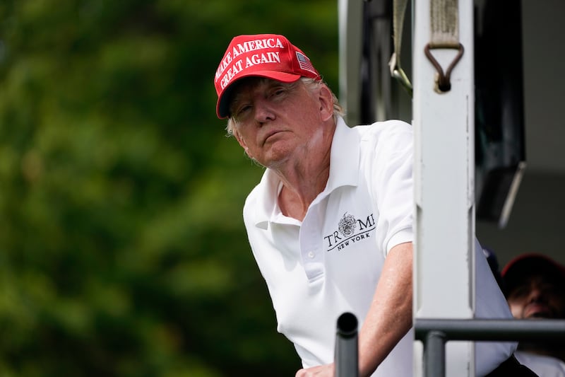 Former President Donald Trump interacts with the crowd during the final round of the Bedminster Invitational LIV Golf tournament in Bedminster, N.J.