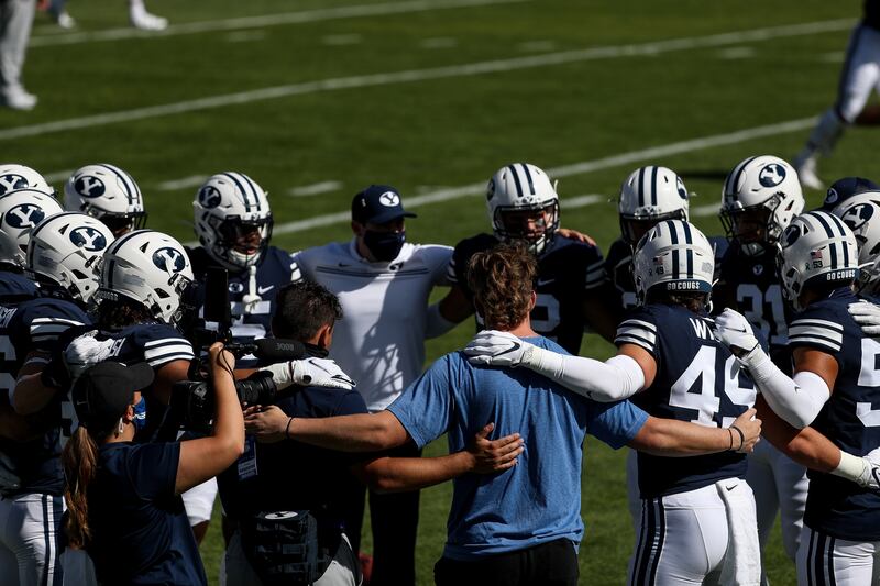 Brigham Young Cougars players huddle before the game against UTSA. The program got its third commitment from an offensive lineman in five days from Pine View’s Peter Falaniko.