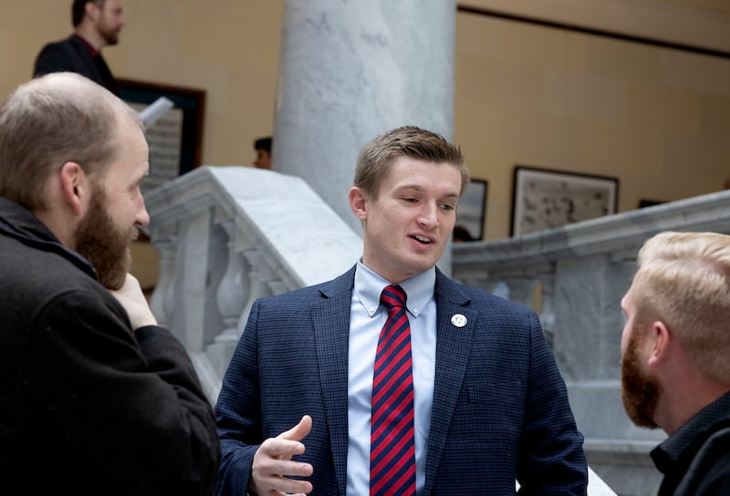 Rep. Tyler Clancy, R-Provo, center, speaks with lobbyists at the Capitol in Salt Lake City on Feb. 1, 2023.