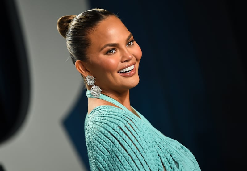 Chrissy Teigen arrives at the Vanity Fair Oscar Party on Sunday, Feb. 9, 2020, in Beverly Hills, Calif. (Photo by Evan Agostini/Invision/AP)
