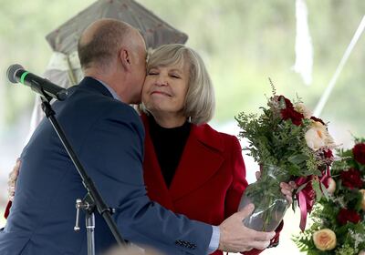 Utah State Hospital Superintendent Dallas Earnshaw thanks hospital historian Janina Chilton on Wednesday, Oct. 10, 2018, during the unveiling of a monument featuring the names of 485 former patients of the then-Utah Territorial Insane Asylum who were buri