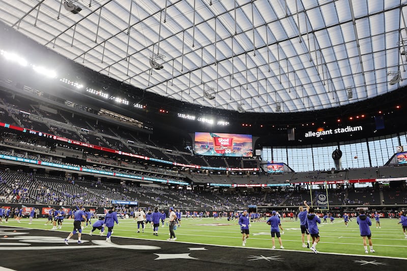 BYU football players warm up in Allegiant Stadium prior to the Vegas Kickoff Classic between BYU and Arizona.