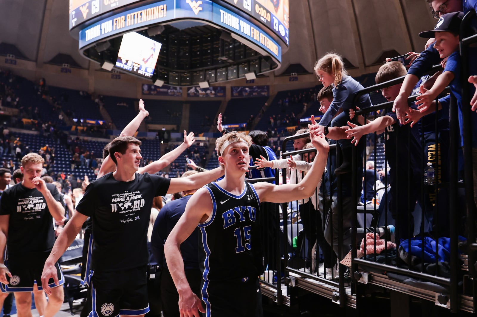 BYU players exit the court after defeating West Virginia in Morgantown Tuesday, Feb. 11, 2025.