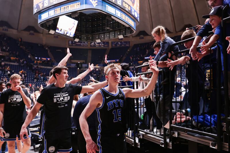 BYU players exit the court after defeating  West Virginia in Morgantown Tuesday, Feb. 11, 2025.