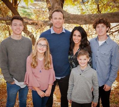 Casey Child is photographed with his wife and kids.