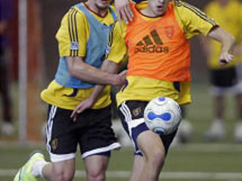 Joey Worthen, left, and Steve Magleby chase the ball during Real Salt Lake's training camp at Eccles Field House on Wednesday.