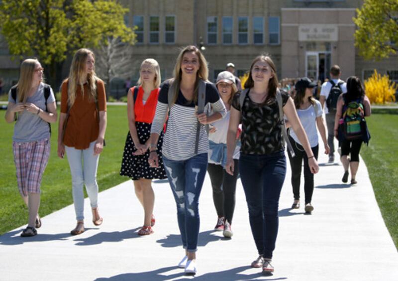 FILE: People walk across the quad at Utah State University in Logan on Wednesday, April 20, 2016.