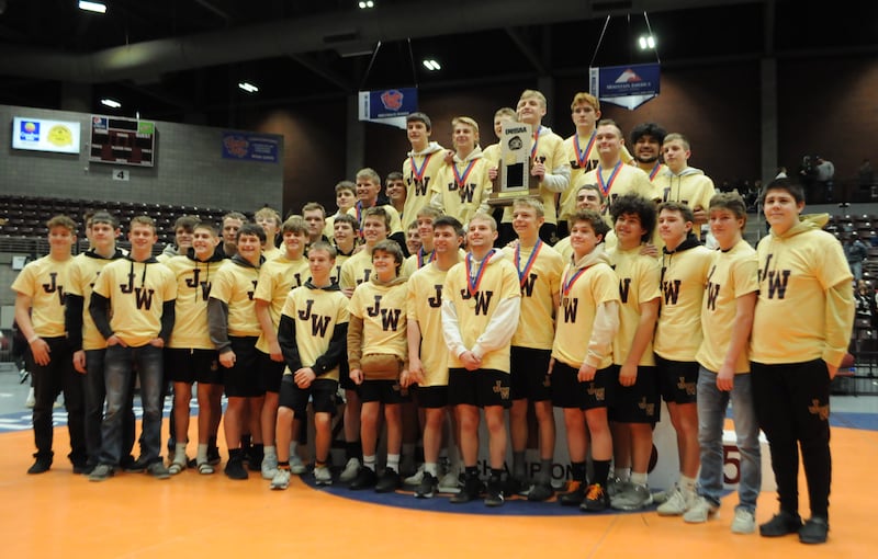 The Juab boys wrestling team holds up its eighth consecutive team wresting trophy Saturday, Feb. 17, 2024, at the Sevier Valley Center in Richfield.