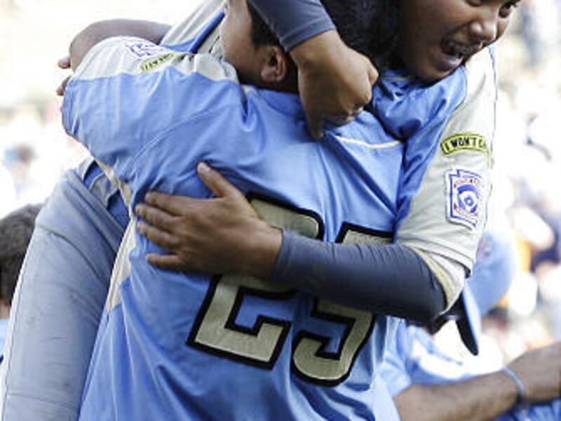 Chula Vista, Calif.'s Andy Rios is lifted by Isaiah Armenta after theLittle League World Series Championship baseball game, Sunday, Aug. 30, 2009, in South Williamsport, Pa. Chula Vista defeated Taoyuan, Taiwan, 6-3.