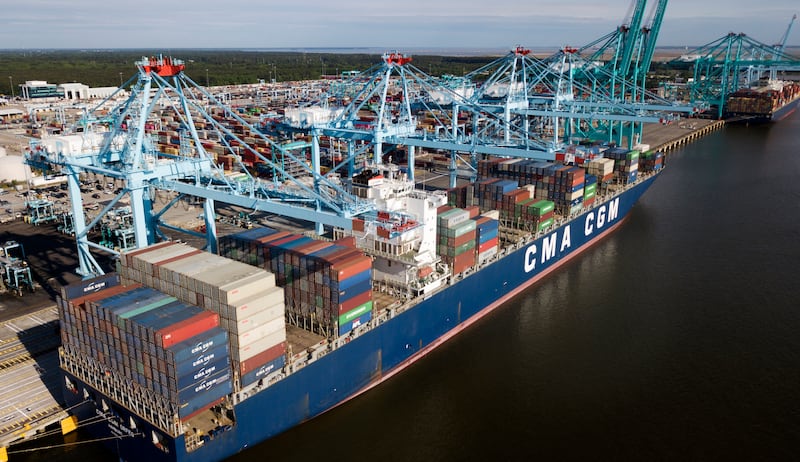 In this May 9, 2019, file photo a container ship is unloaded at the Virginia International Gateway terminal in Norfolk, Va. China has announced tariff hikes on $60 billion of U.S. goods in retaliation for President Donald Trump's escalation of a fight ove