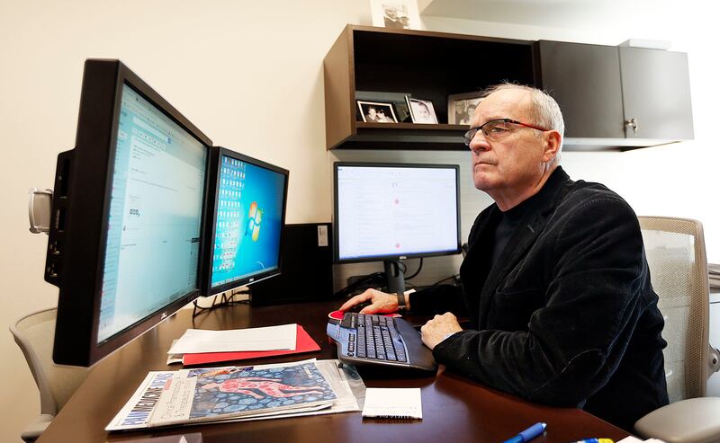 Dr. Lynn Webster works in his office at PRA Health Sciences in Millcreek on Thursday, Oct. 19, 2017.