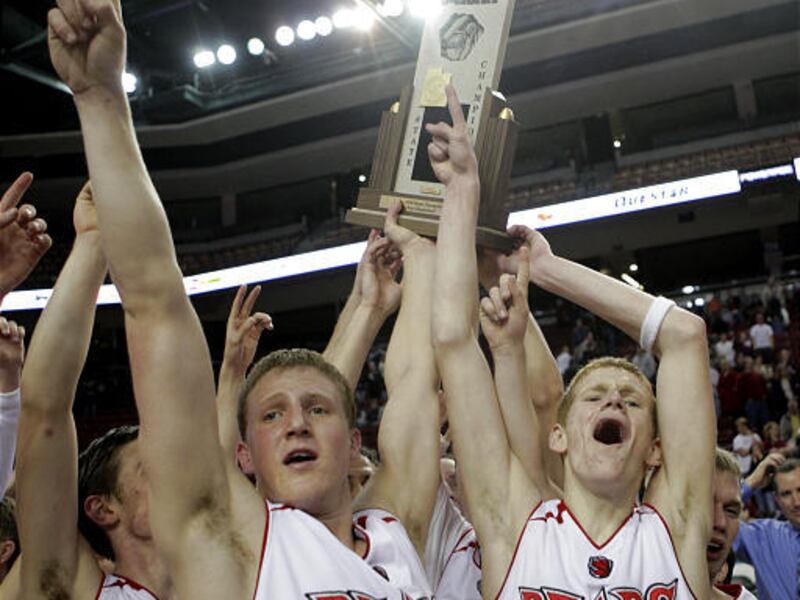 Wade Bronson, Morgan Park and their Bear River teammates celebrate after winning the 3A state championship.