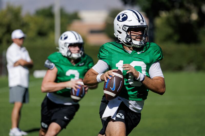 BYU QBs McCae Hillstead and Treyson Bourguet go through drills during fall camp in Provo. The two QBs (and freshman) Bear Bachmeier) are battling to be the Cougars' starting QB this season.