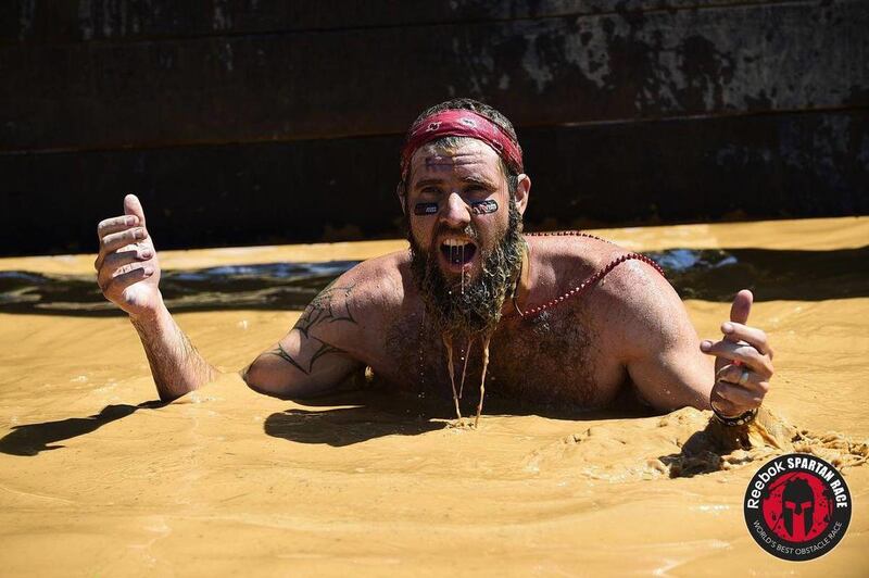 Scott Keneally participating in a Spartan Race. The California journalist spent several years exploring why obstacle course races like Tough Mudder and Spartan are the world's fastest growing sport.
