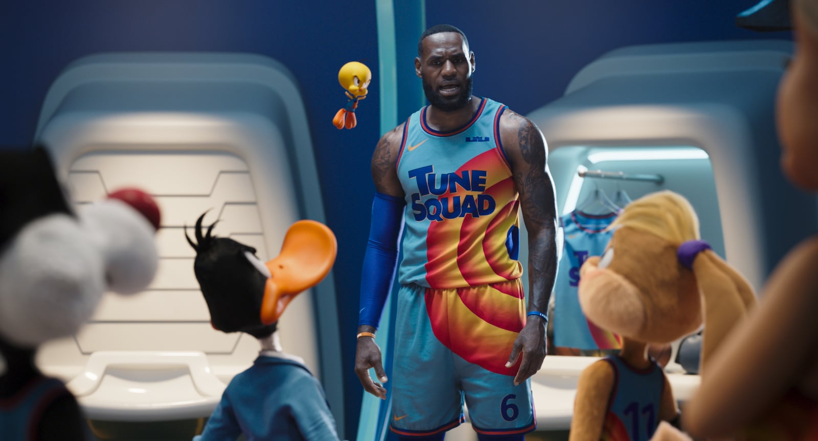 NBA star LeBron James is surrounded by Looney Tunes characters.