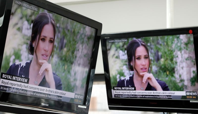 Australian television news in Sydney, Monday, March 8, 2021, reports on an interview of The Duke and Duchess of Sussex by Oprah Winfrey. The interview airs in Australia Monday evening.