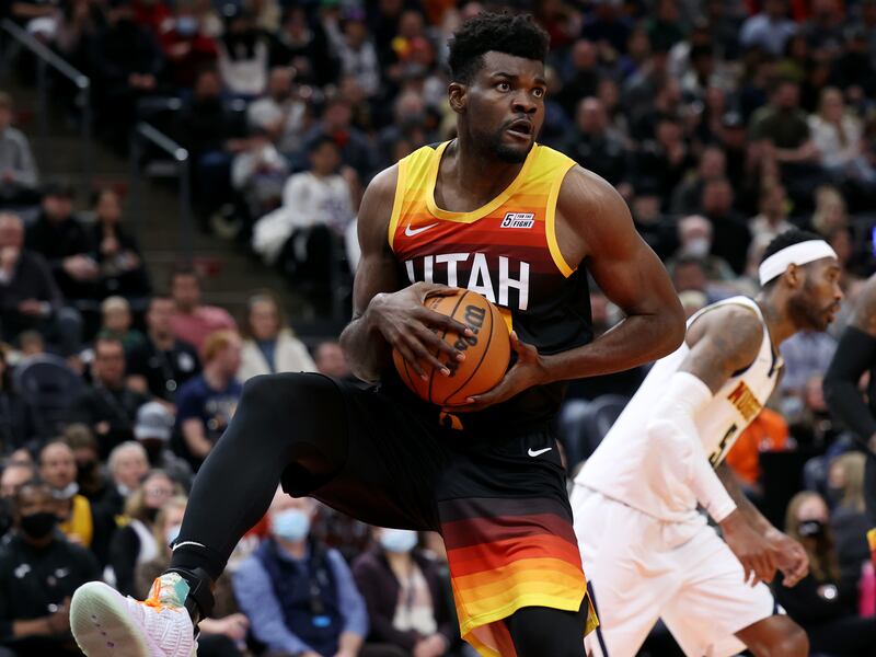Utah Jazz center Udoka Azubuike, wearing black, grabs a rebound
