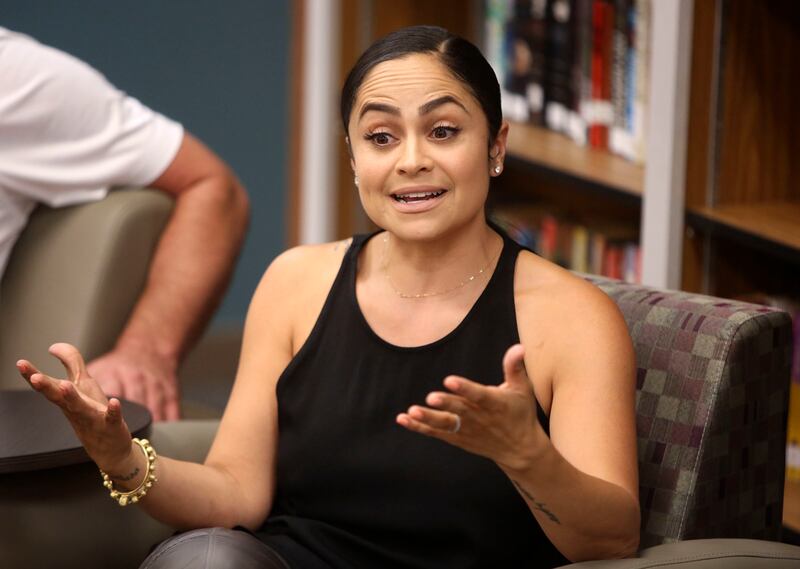 Mia Wright, president of the National Basketball Wives Association Inc. and wife of basketball player Dorell Wright, speaks on a panel about mental illness and athletes at East High School in Salt Lake City on Monday, Aug. 13, 2018.