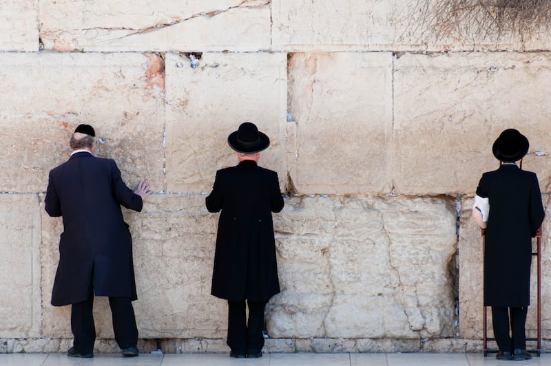 Orthodox Jewish men pray at the Wailing Wall in Jerusalem.