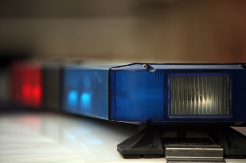 Police arrested a man who they say got into another man’s car and then flashed an airport employee ID badge, claiming he was a police officer.