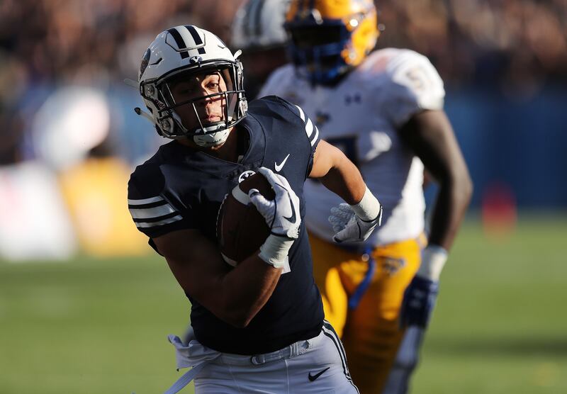 Brigham Young Cougars running back Lopini Katoa (4) runs for a touchdown in Provo on Saturday, Sept. 22, 2018.