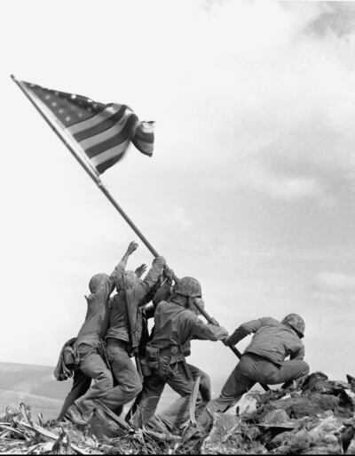 Associated Press photographer Joe Rosenthal captured this image of soldier raising the American flag in Iwo Jima in 1945. It became the basis of the Marine Corps War Memorial.