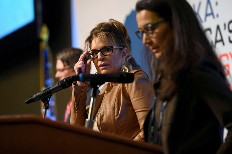 Sarah Palin joins other candidates on stage during a forum for U.S. House candidates in Anchorage, Alaska, on Aug. 31, 2022.