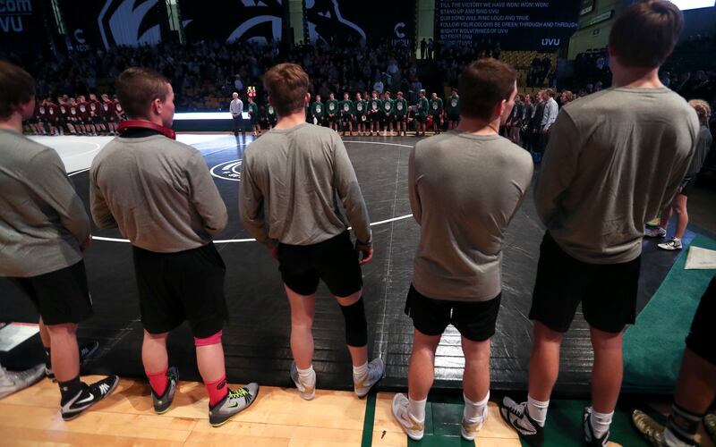 Utah high school wrestlers line up around three mats at the start of the All-Star Dual at the UCCU Center in Orem on Tuesday, Jan. 8, 2019.