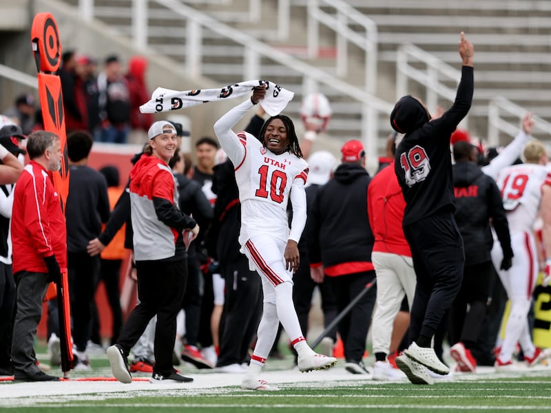 White’s Money Parks waves a towel after the defense took back an interception for a TD as The University of Utah football team plays in the 22 Forever Game at Rice Eccles Stadium in Salt Lake City on Saturday, April 22, 2023. the white team won 38-28 over red.