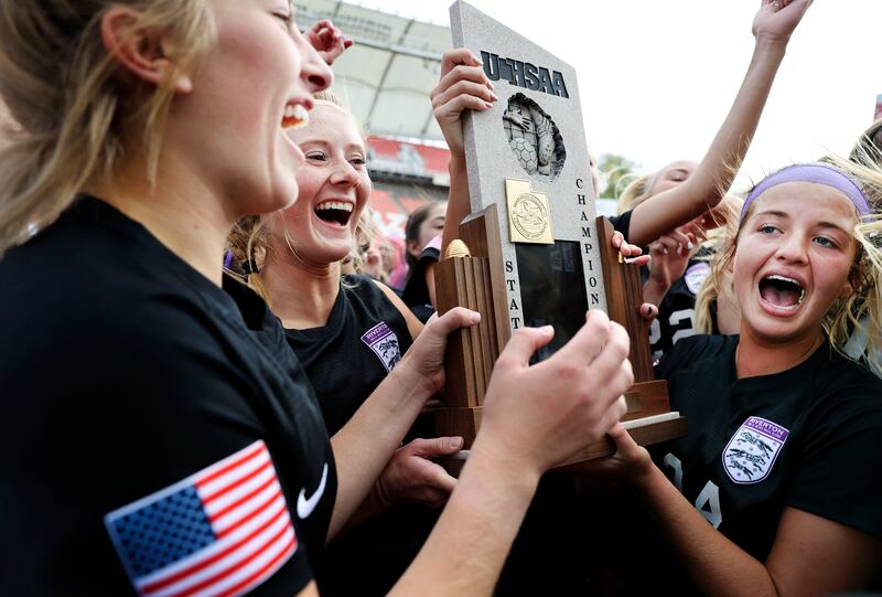 Riverton High School players celebrate their 6A girls soccer state championship win against Skyridge.