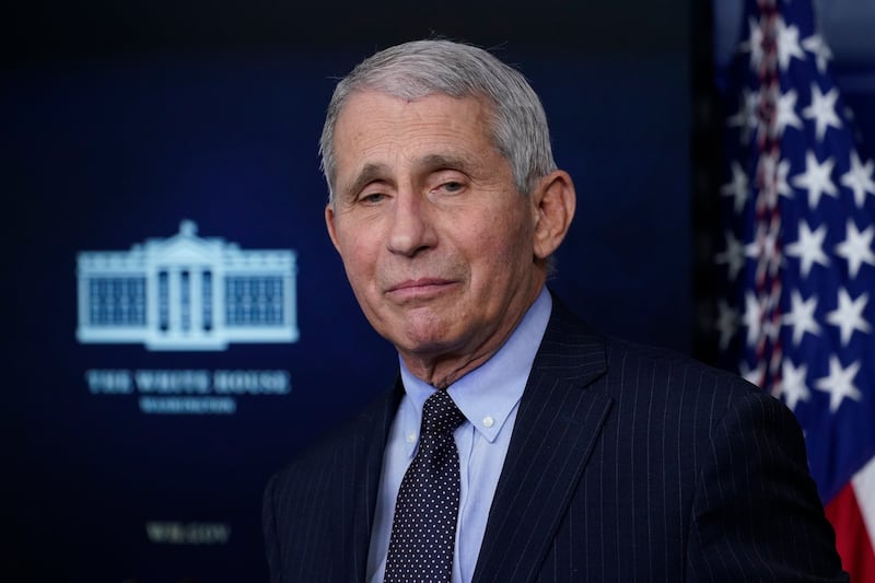 Dr. Anthony Fauci, director of the National Institute of Allergy and Infectious Diseases, listens as he speaks with reporters in the James Brady Press Briefing Room at the White House, Thursday, Jan. 21, 2021, in Washington.
