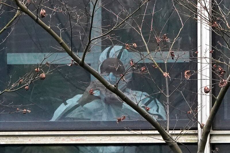 A member of a World Health Organization team at the Hubei Animal Disease Control and Prevention Center in Wuhan in central China’s Hubei province.